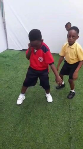 School children dance with teachers in Lagos area