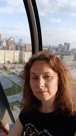 Visitors enjoy glass observation ride in Yekaterinburg on sunny afternoon