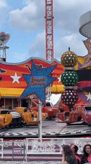 Carnival rides and Vienna Giant Ferris Wheel captured
