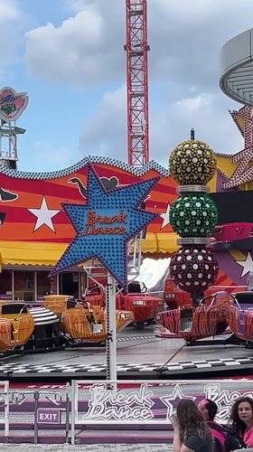 Carnival rides and Vienna Giant Ferris Wheel captured