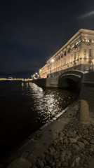 Nighttime illuminated Saint Petersburg waterfront captured along Neva River
