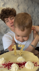 Birthday celebration with cake and candles in Rusanovo, Russia
