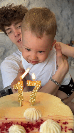 Birthday celebration with cake and candles in Rusanovo, Russia