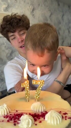 Birthday celebration with cake and candles in Rusanovo, Russia