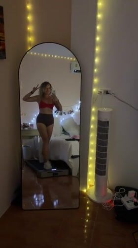 Peace sign selfie on a treadmill in a Thai gym