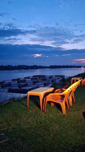 Evening life captured along Lhokseumawe waterfront during dusk hour