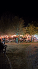 Evening diners gather at illuminated outdoor café in Fethiye