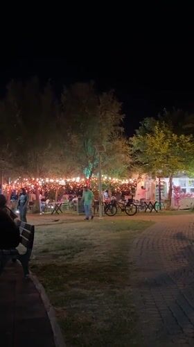 Evening diners gather at illuminated outdoor café in Fethiye