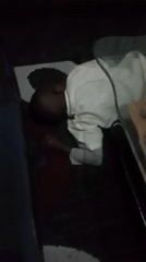 Child resting indoors in Kenyan ward