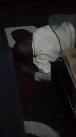 Child resting indoors in Kenyan ward