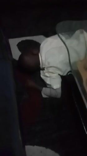 Child resting indoors in Kenyan ward