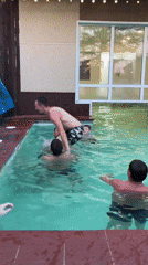Men perform acrobatic backflip stunt in Chaikovsky pool