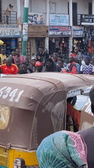 Busy street and market activity in Bukuru, Nigeria
