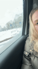 Tired woman in green jacket observed in rainy Perm