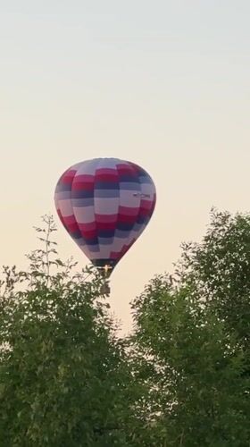 Hot air balloons launch at dusk outside Dmitrov