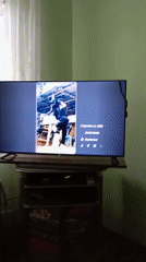 Person watches social media videos on TV in Chirchik