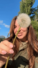 Woman enjoys spring flower photography session in Kryvyi Rih