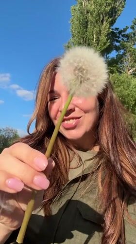 Woman enjoys spring flower photography session in Kryvyi Rih