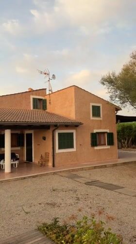 Summer evening at a Mallorcan holiday home, pool and all.
