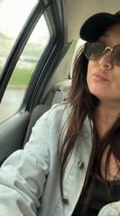 Woman in car during rainy weather captured on camera