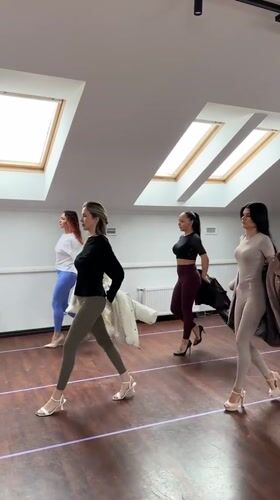 Four women practice runway walking in Riga studio