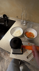 Mother feeds baby red soup during mealtime in Khimki