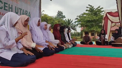 Students perform traditional dance at outdoor event in Blangriek