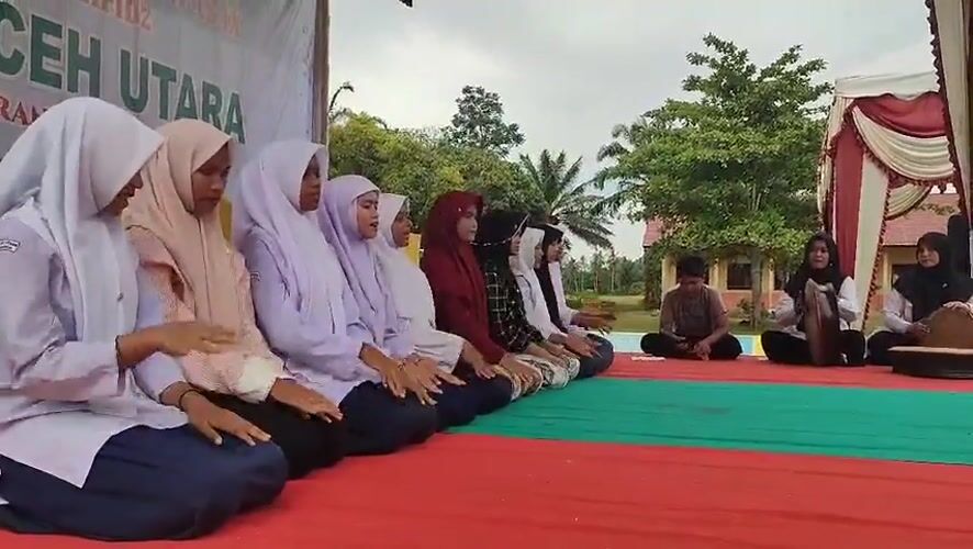 Students perform traditional dance at outdoor event in Blangriek