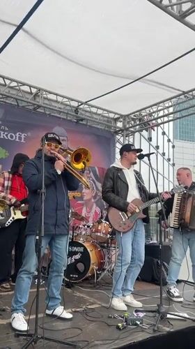 Band performs with bear mascot in Novosibirsk street event