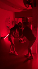 Couples dance in red-lit venue on Ko Pha-ngan