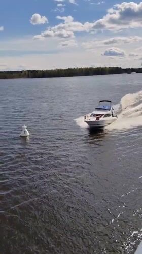White motorboat spotted moving through waters near Kondratovo, Russia