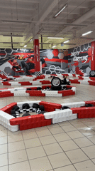 Indoor karting session with child participant observed in Riga