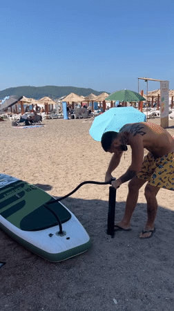 SUP board getting inflated on a Montenegrin beach