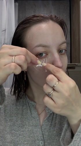 Woman documents morning skincare routine in Russian bathroom