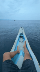 Person resting in wooden boat observed in Buleleng, Indonesia