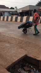 Wheelbarrow traffic documented on Isieke streets during afternoon hours