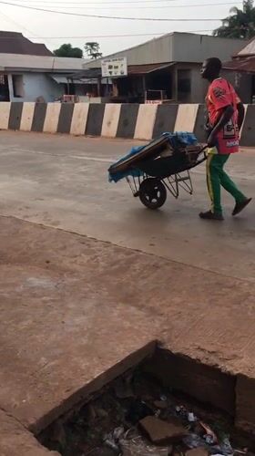 Wheelbarrow traffic documented on Isieke streets during afternoon hours