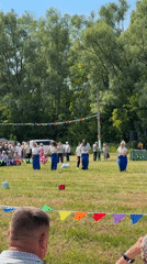 Community festival features accordion music, sack races in sunny field