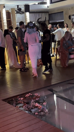 Poolside night event with DJ and floral décor in North Kuta