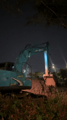 Nighttime excavator operations documented near Tangerang waterfront and hospital