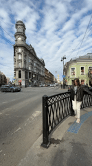 Woman observed on busy Saint Petersburg street amid ornate architecture