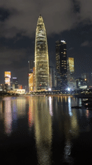 Shenzhen's Nanshan skyline glows across the water at night
