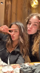Friends celebrate winter evening with dinner in Courchevel