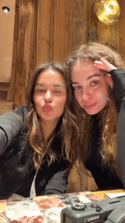 Friends celebrate winter evening with dinner in Courchevel