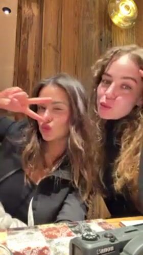 Friends celebrate winter evening with dinner in Courchevel
