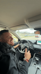Driver enjoys music while driving in Northbrook