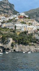 Tourist captures scenic Amalfi Coast views from sea and shore