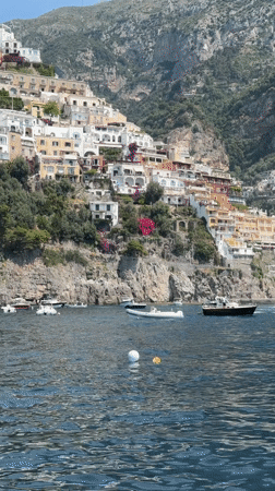 Tourist captures scenic Amalfi Coast views from sea and shore