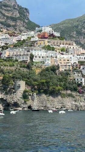 Tourist captures scenic Amalfi Coast views from sea and shore