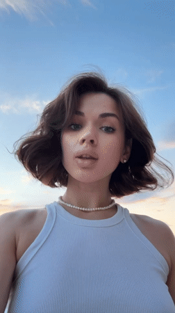 Woman records sunset selfies in Sarapul amid dramatic skies